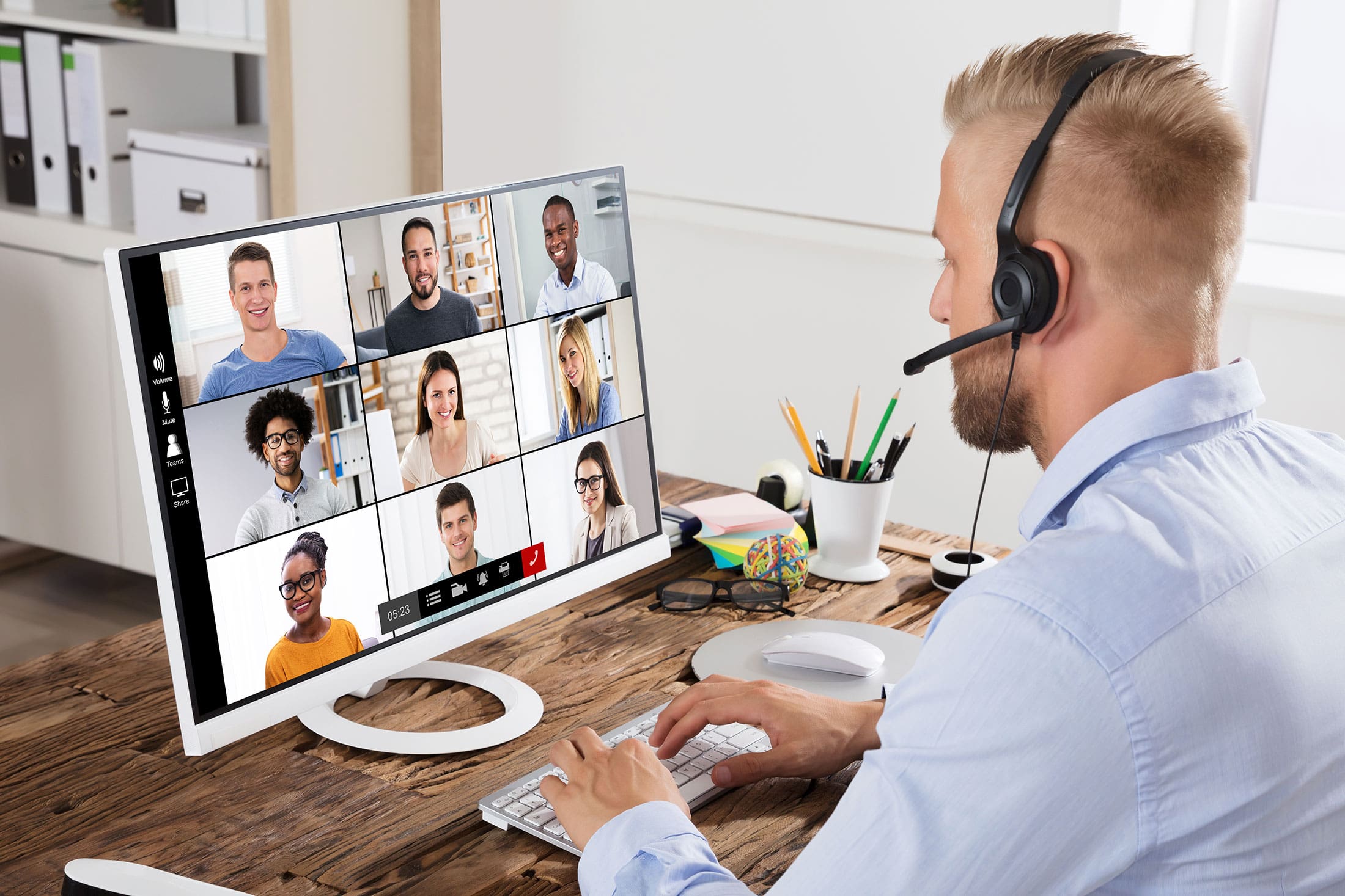Man with headset on during a remote meeting