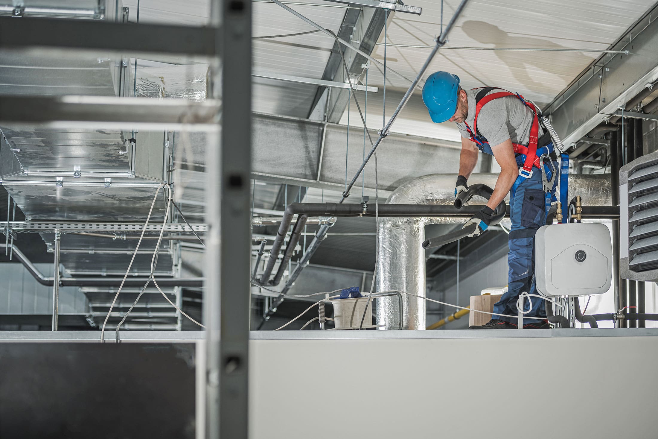 Improved-Sensors-Could-Reduce-Energy-Used-for-HVAC-Systems HVAC man testing and working in factory
