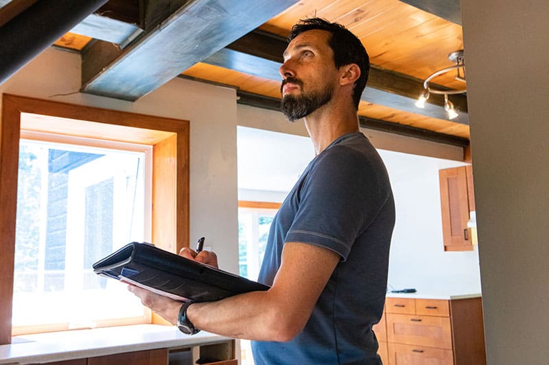 indoor-testing Man consulting roofing