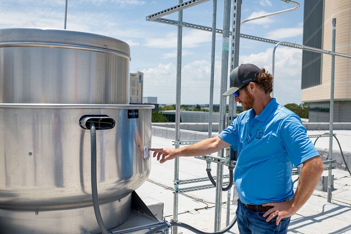 A man from SITA is testing out the air tight building systems