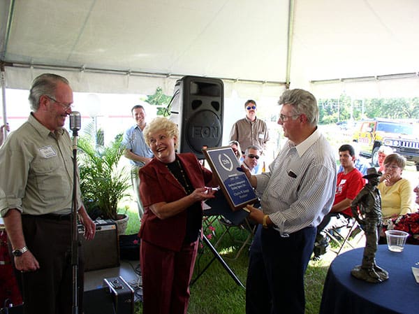 Neal White (FEBB Chapter Coordinator) presents to Linda and Charles Kaupp an award for 25 years of business.