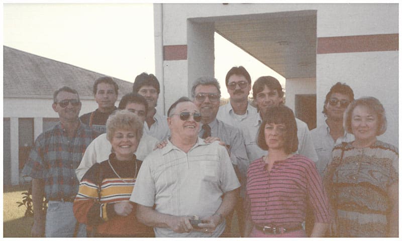 The SITA team and family photo with 12 people in the 90s