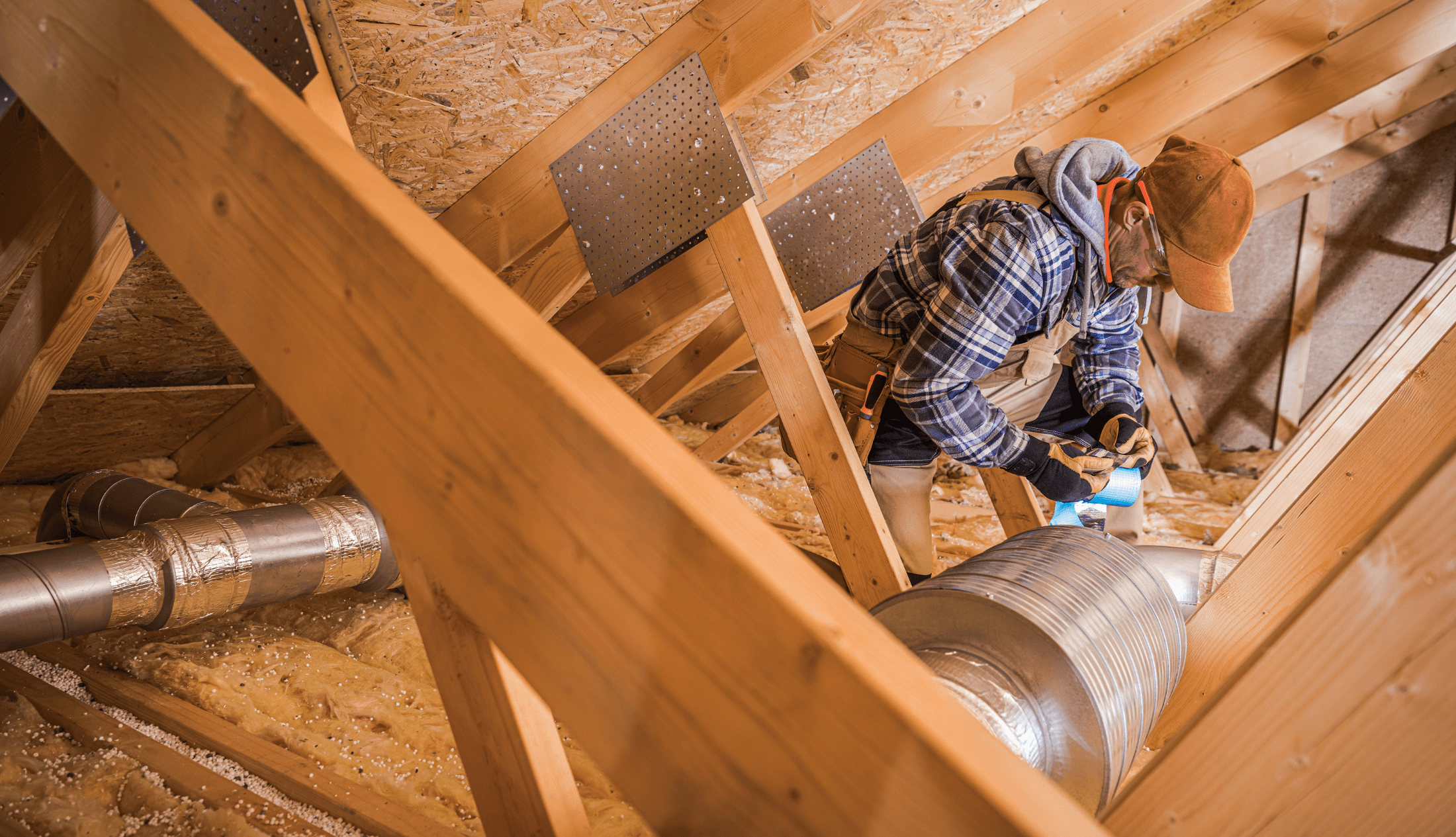Maximize Efficiency and Comfort with Air Barriers HVAC Technician Installing Air Duct Filter